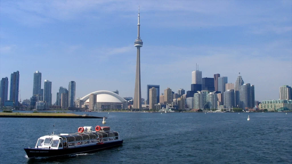 A group of friends enjoying a boat party on Lake Ontario with JetSkiGTA’s boat rental.