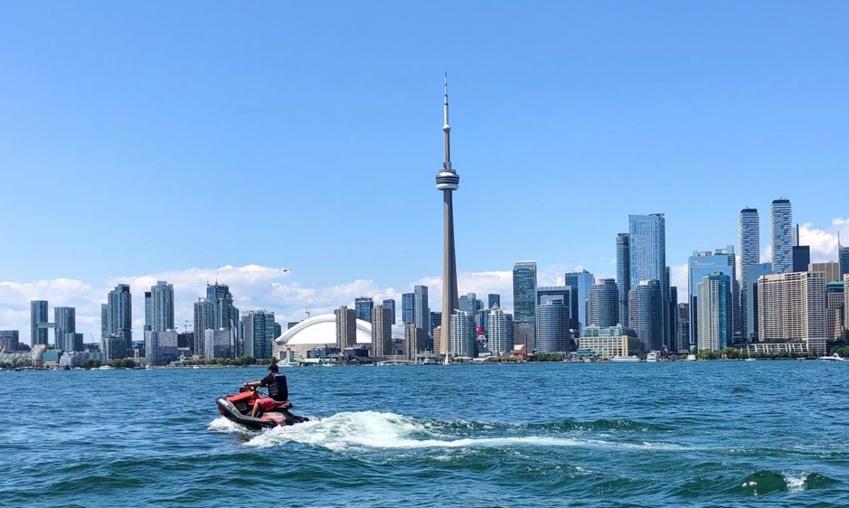 Jet ski from JetSkiGTA on Lake Ontario with a view of the CN Tower and Toronto skyline, near Mississauga.