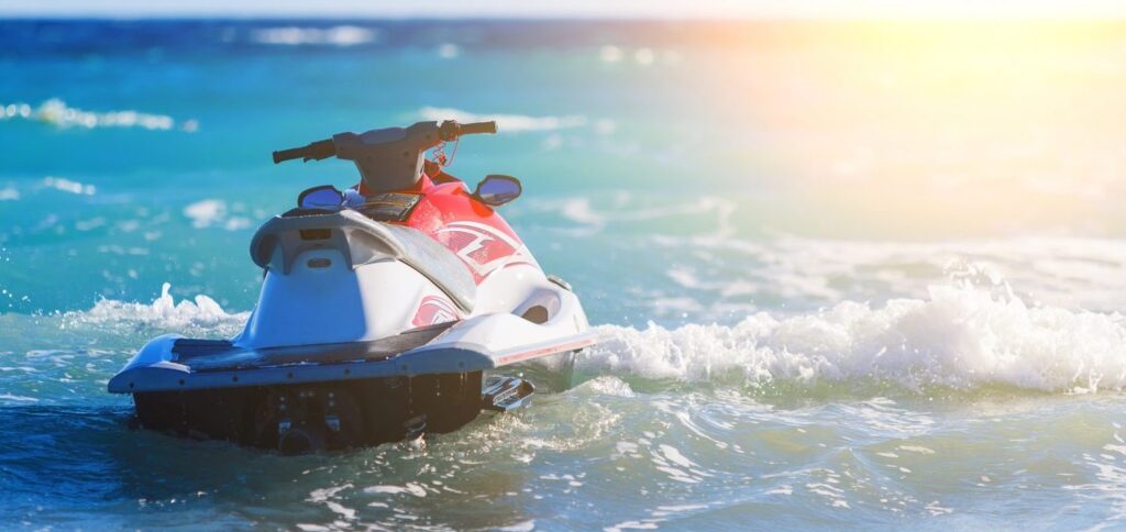 JetSkiGTA jet ski cruising on Lake Ontario near Mississauga’s Port Credit, with scenic waterfront views.