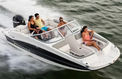 A group of friends enjoying a boat party on Lake Ontario with the Toronto skyline in the background, departing from Scarborough Bluffers Park.