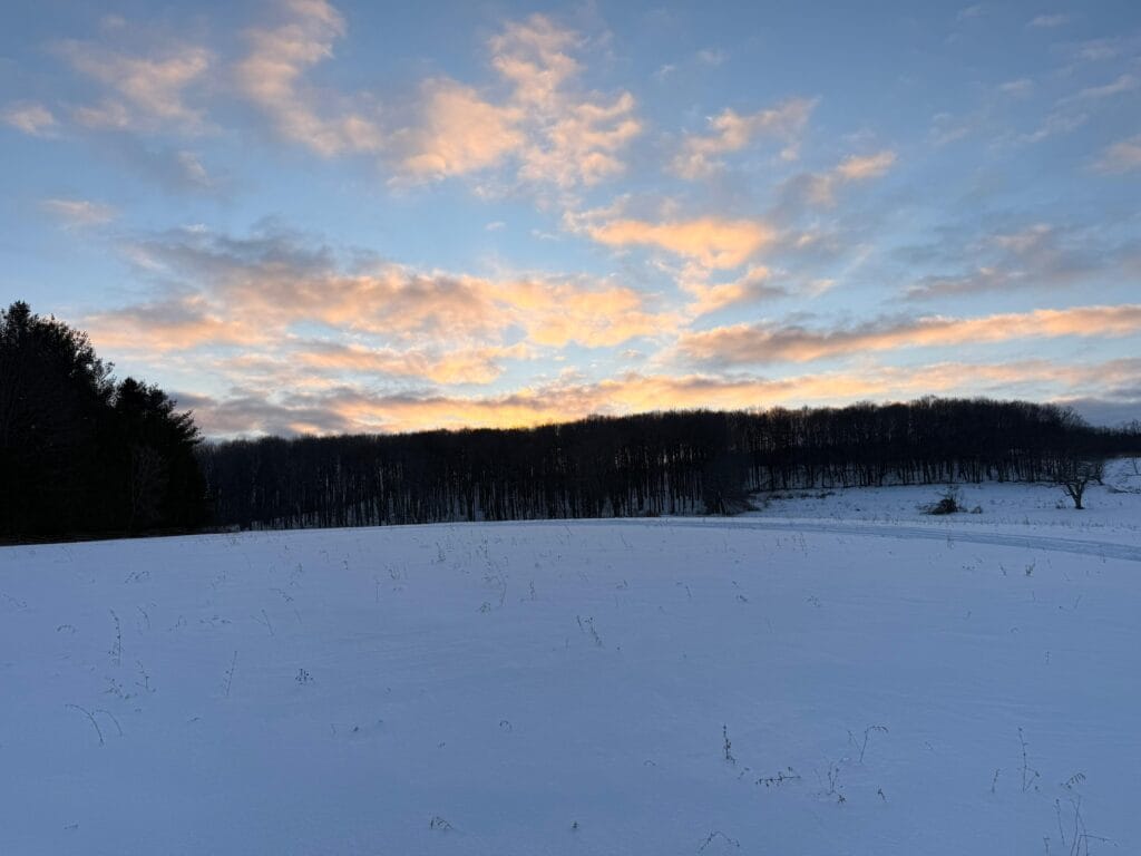picture of a farm land full of snow ready to be explored with snowmobiles