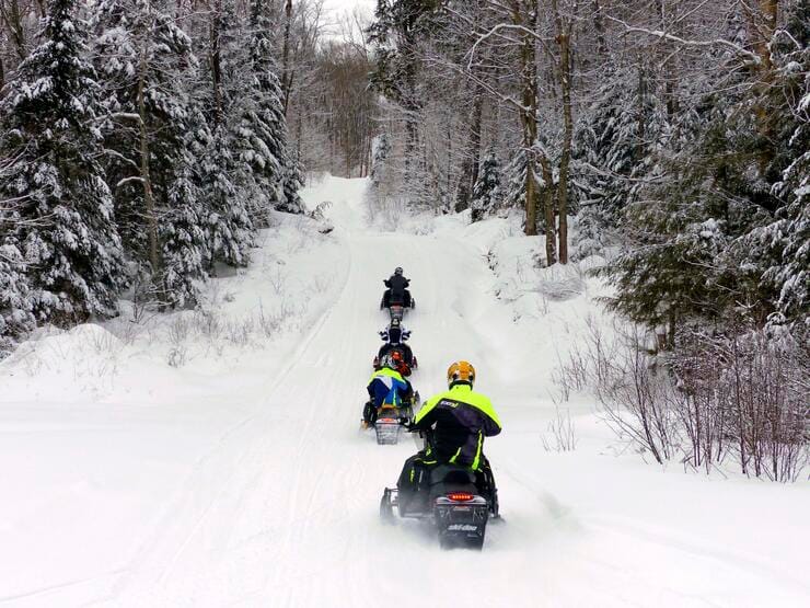 Snowmobile rental riding through OFSC trails near Orangeville Ontario