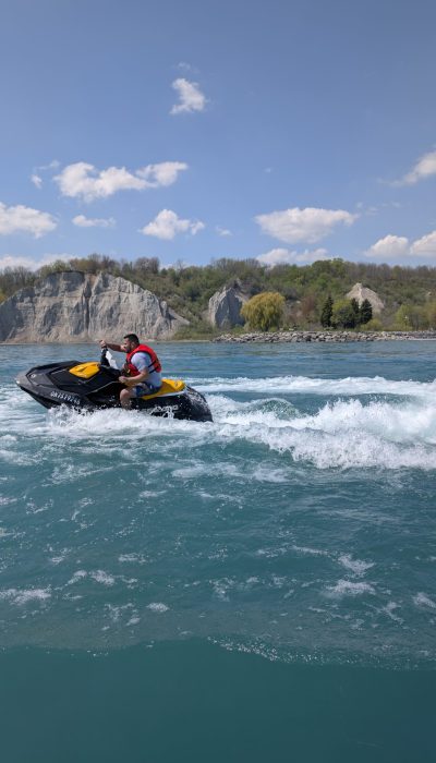 blue waters of scarborough and orange sky with green cliffs, you can get all that in scarborough with a jet ski rental with jetskigta