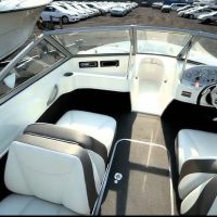 A rental boat speeding across Lake Ontario near Bluffers Park Beach, offering an exciting boat rental experience in Toronto, Scarborough, and the GTA.