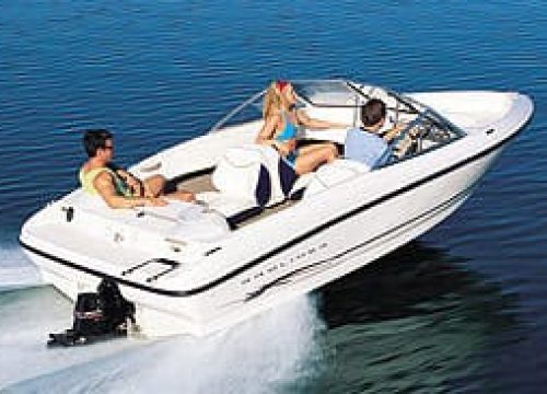 A rental boat gliding across Lake Ontario near Bluffers Park Beach, offering the best boat rental experience in Toronto, Scarborough, and the GTA.