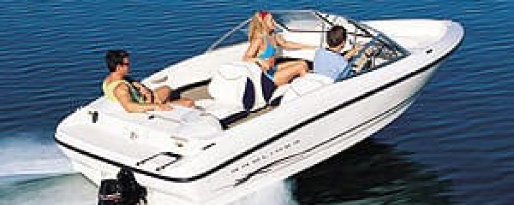 A rental boat gliding across Lake Ontario near Bluffers Park Beach, offering the best boat rental experience in Toronto, Scarborough, and the GTA.
