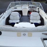 A sleek rental boat cruising on Lake Ontario near Bluffers Park Beach, offering a premium boat rental experience and jet ski rentals in Toronto, Scarborough, and the GTA.