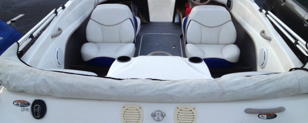 A sleek rental boat cruising on Lake Ontario near Bluffers Park Beach, offering a premium boat rental experience and jet ski rentals in Toronto, Scarborough, and the GTA.